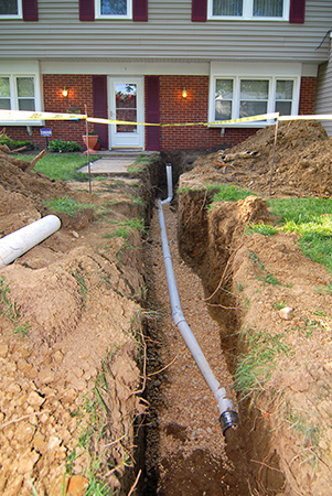 house_with_sewer_line_dug_up_w301h450.jpg
